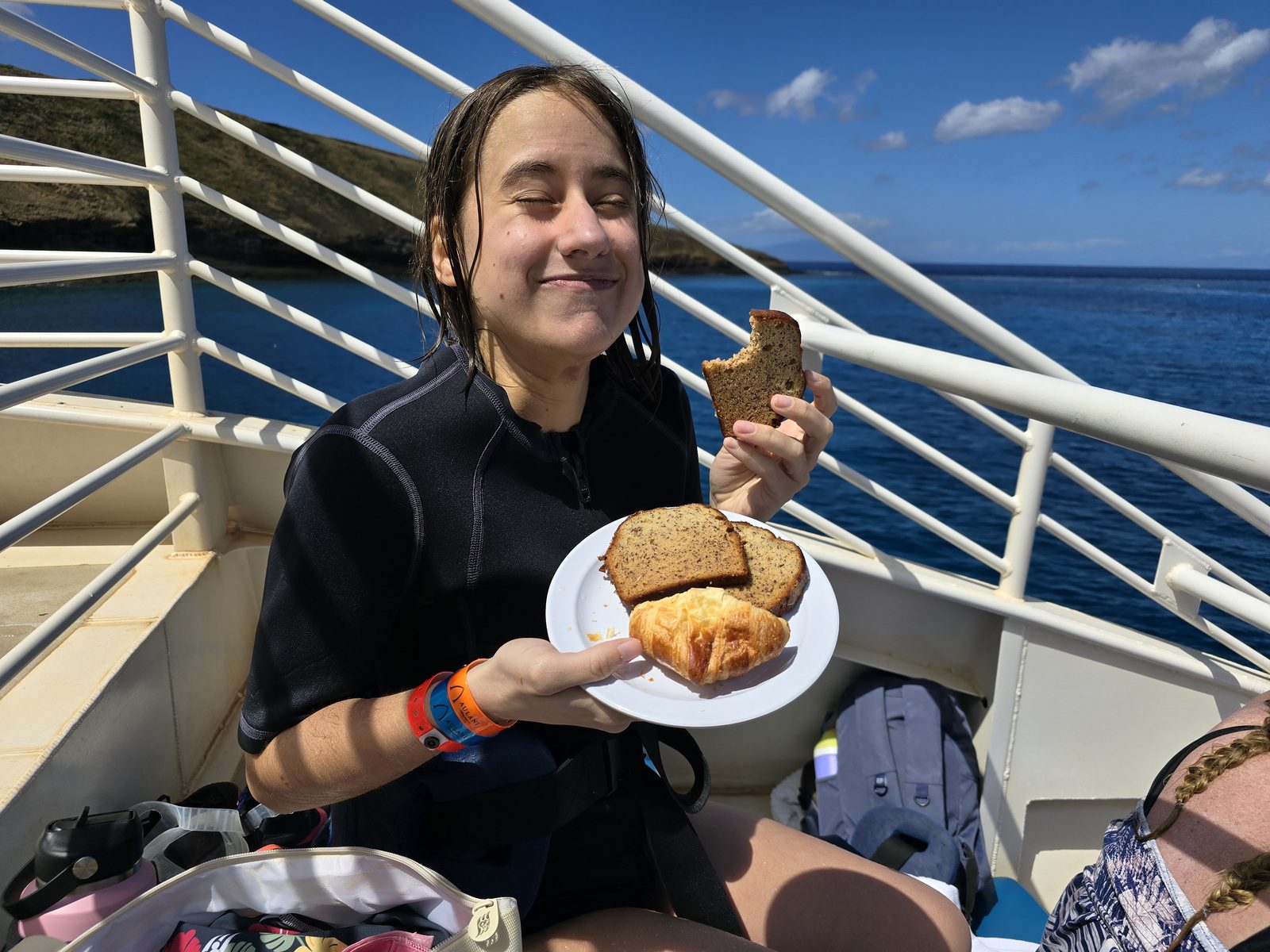 Lisa with breakfast on the snorkel boat at Molokini