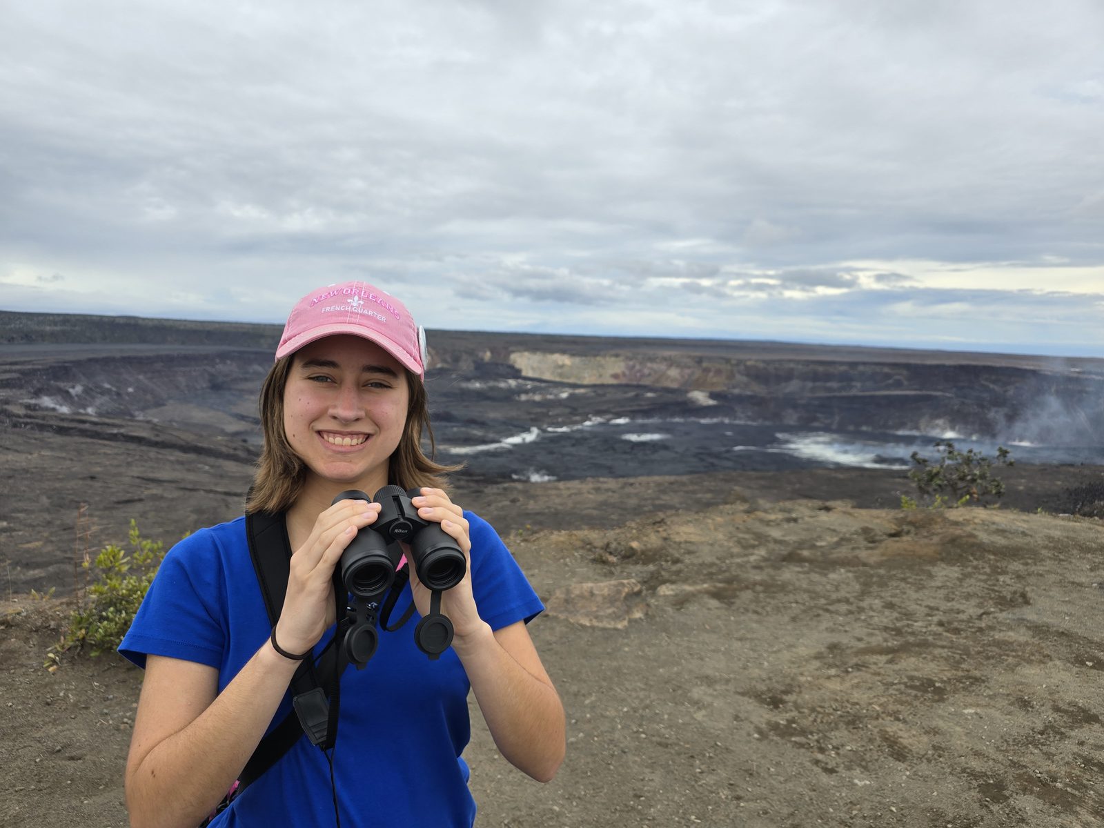 Lisa scanning the crater with binoculars