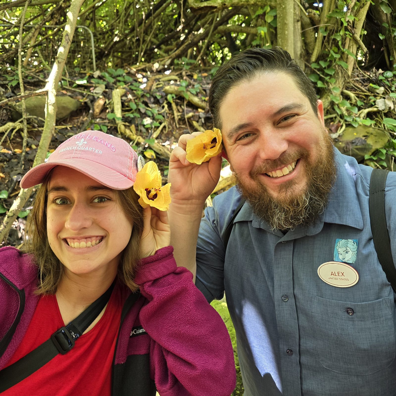 Alex and Lisa with a yellow flower