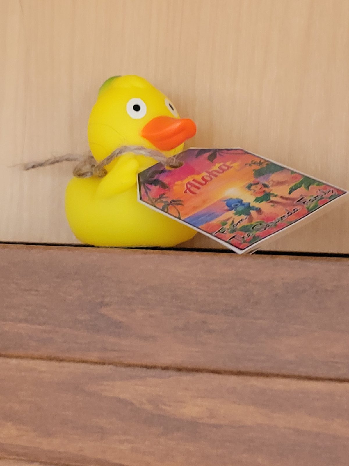 A rubber duck with a little aloha tag
