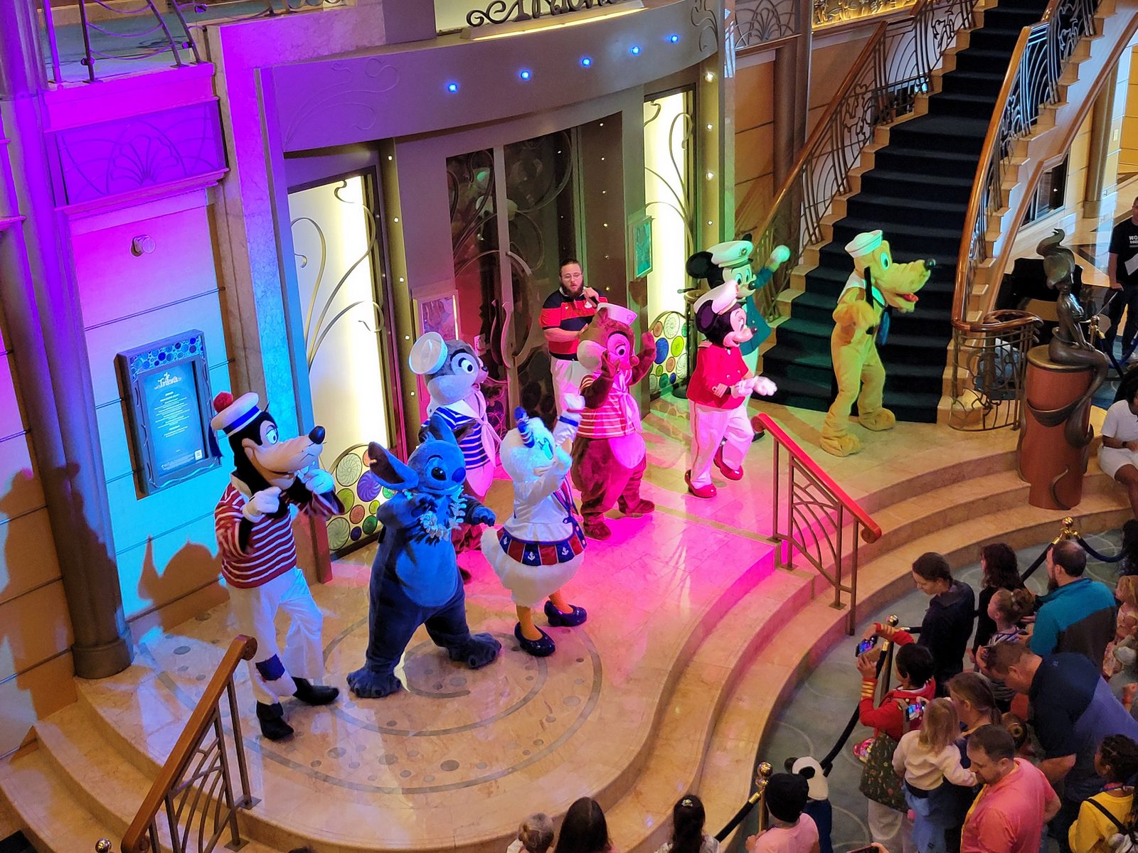 Goofy & Donald in red-striped sailor outfits with Stitch, Chip, Dale, Mickey, Minnie, Daisy & Pluto in the Lobby Atrium