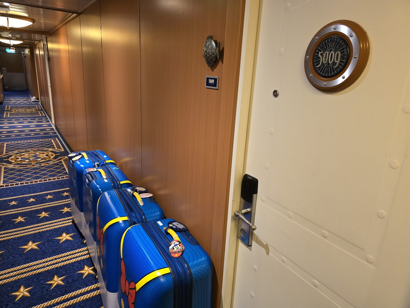 Suitcases packed outside stateroom 5009