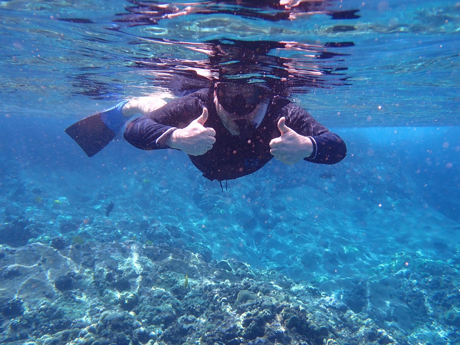 Two thumbs up while snorkeling at Molokini Crater
