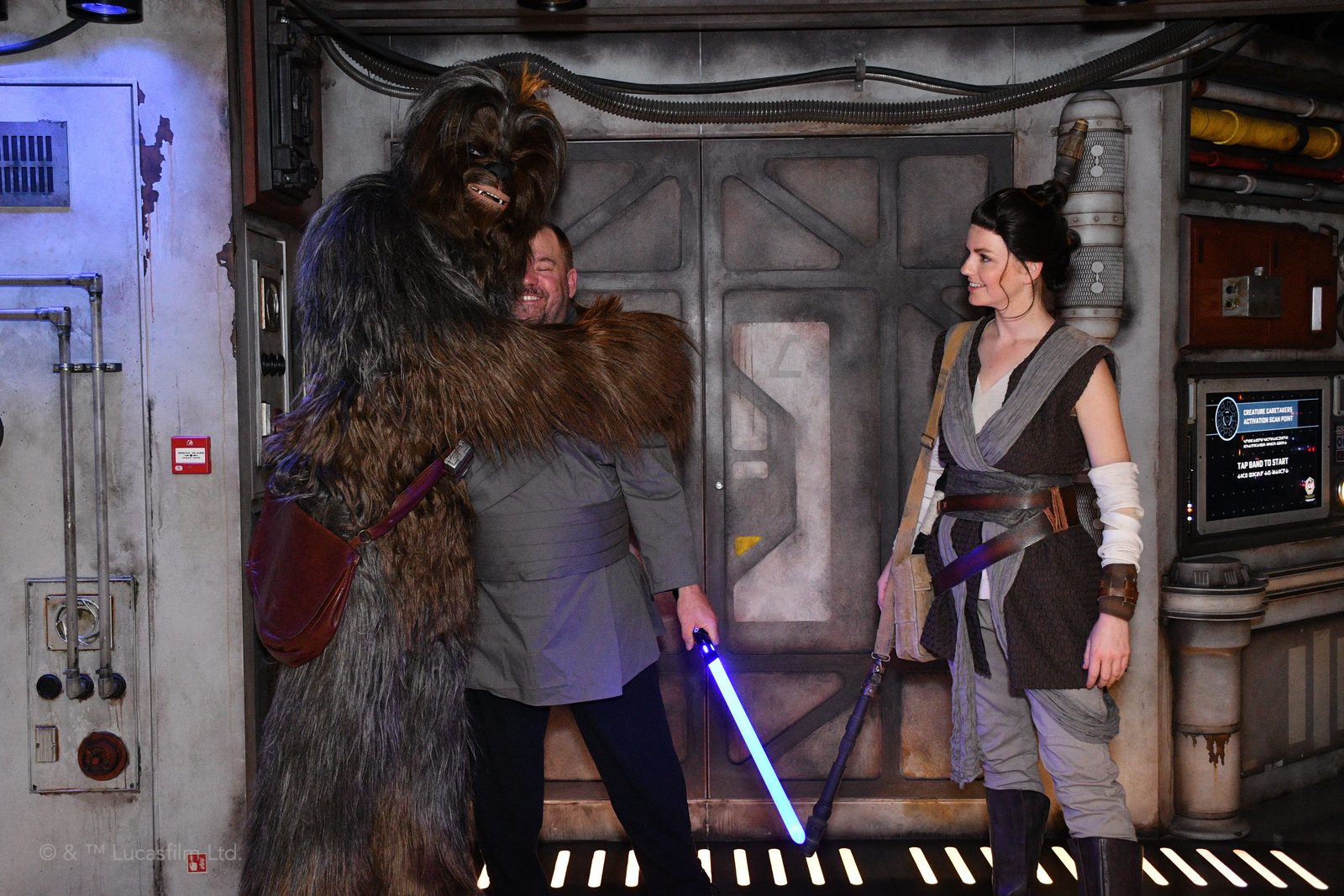 Chewbacca hugs Michael next to Rey at the Star Wars meet