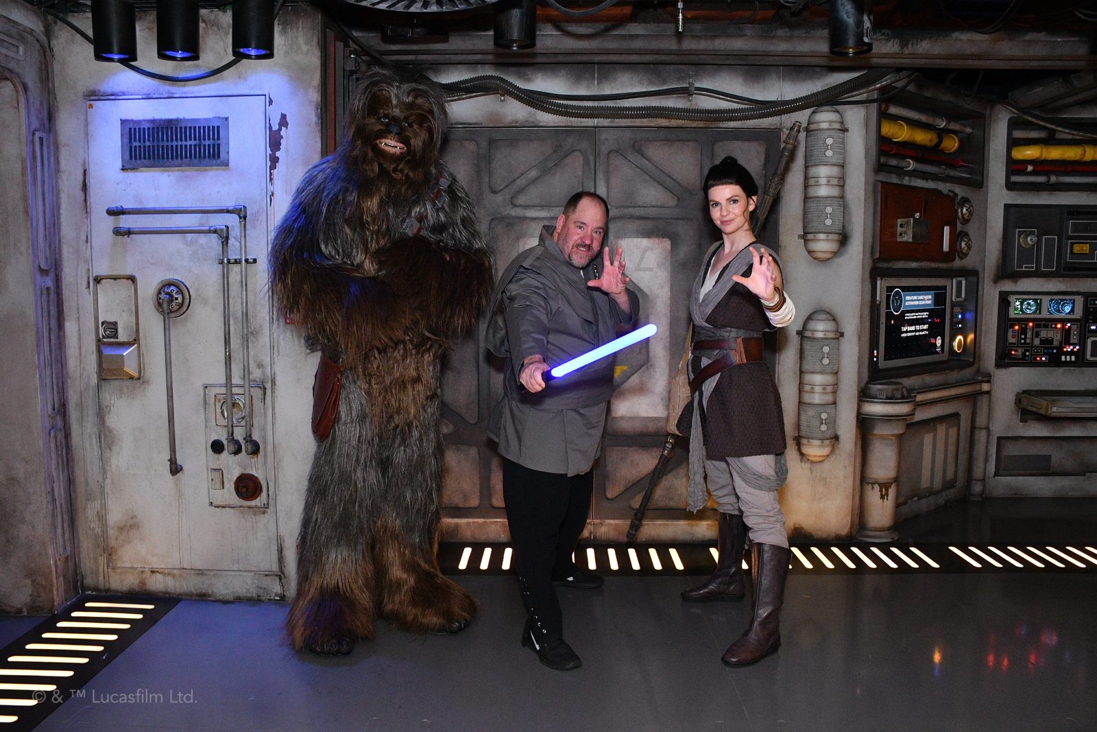 Chewbacca, Michael with a lightsaber & Rey at the Star Wars meet