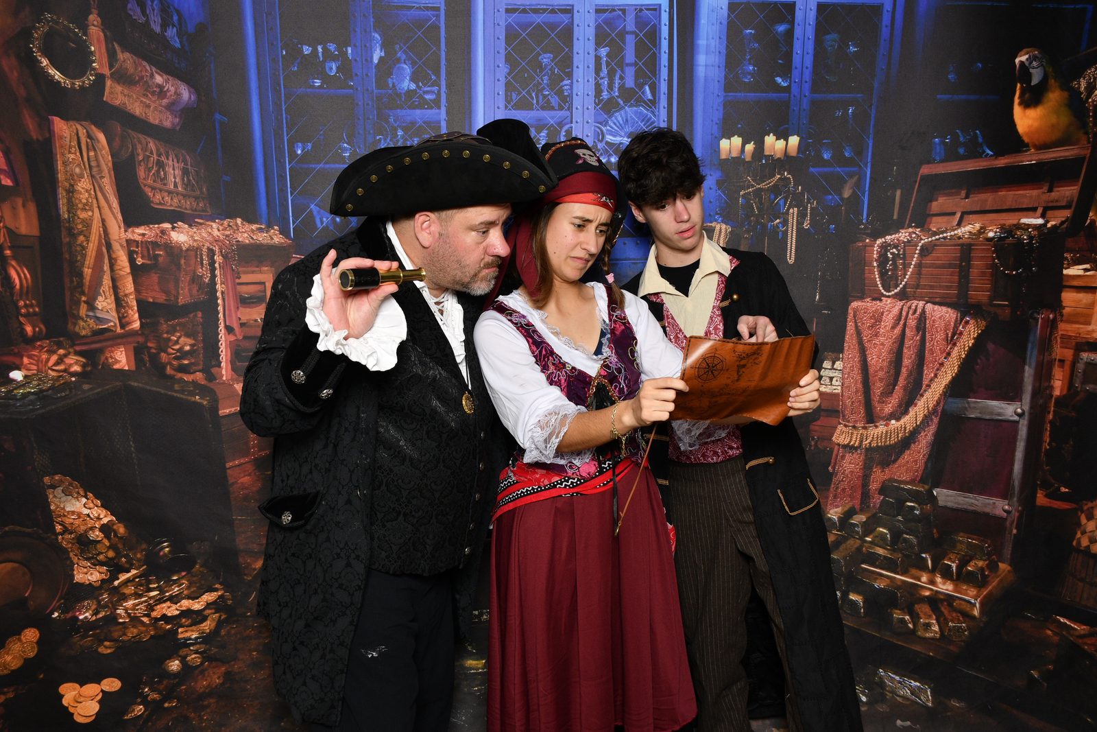 The kids and Michael studying a treasure map on Pirate Night