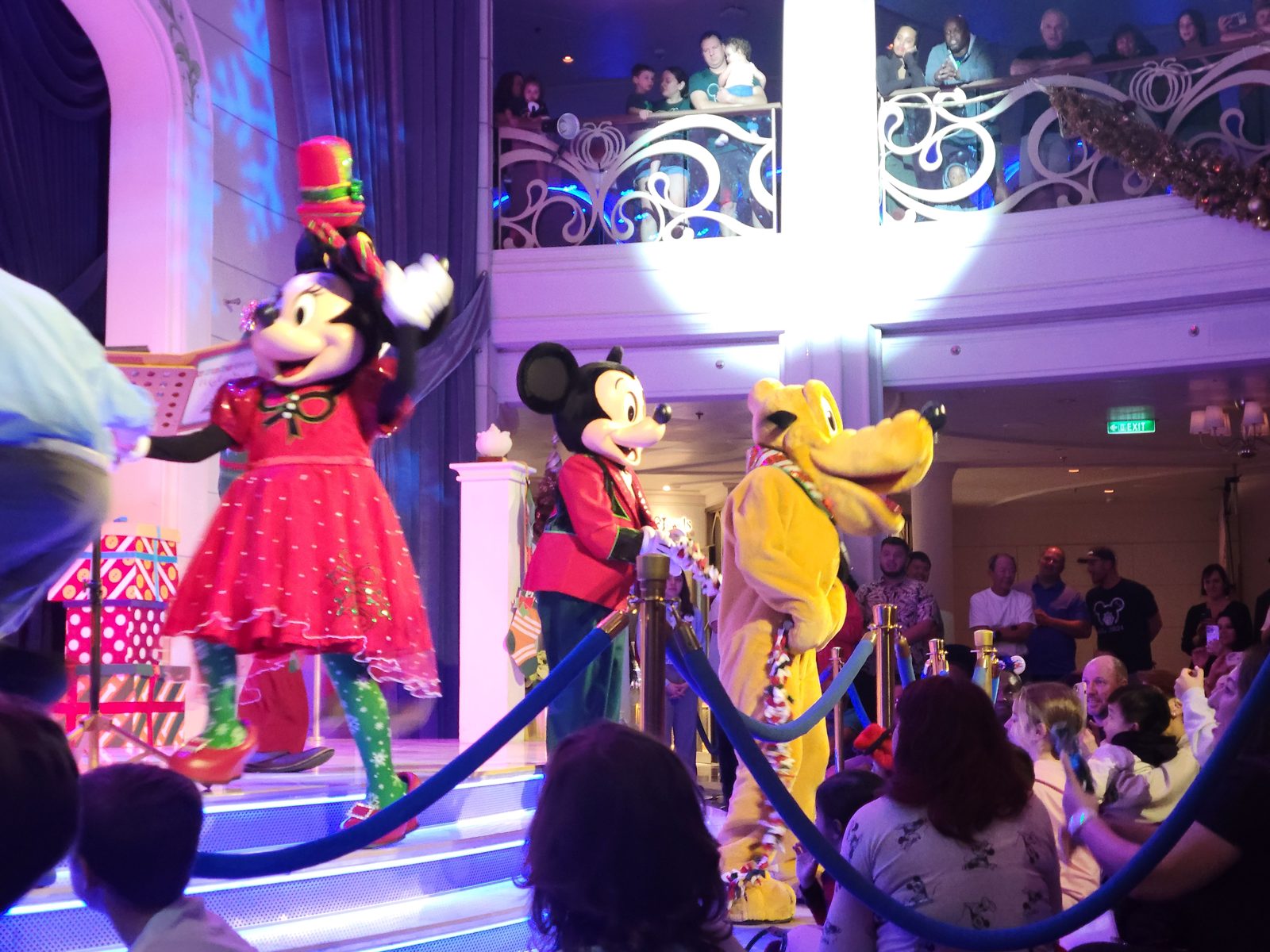 Mickey, Minnie, and Pluto in Christmas outfits