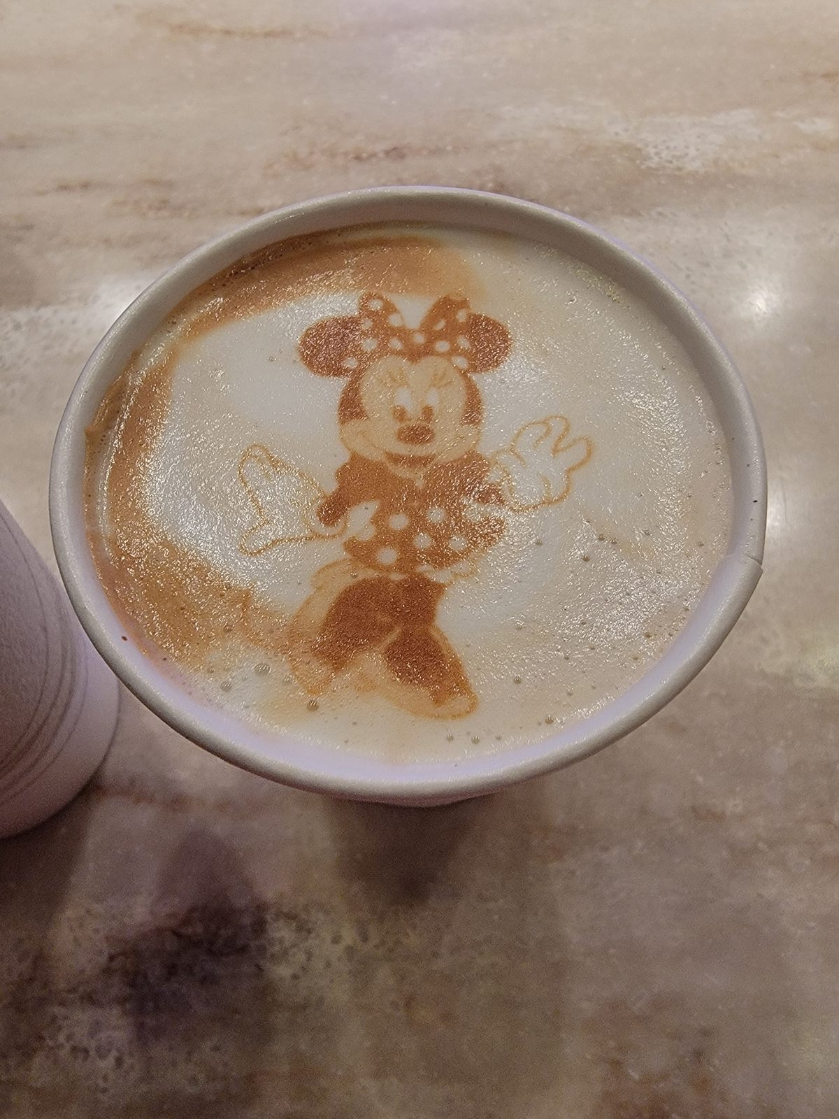Minnie Mouse traced in latte foam