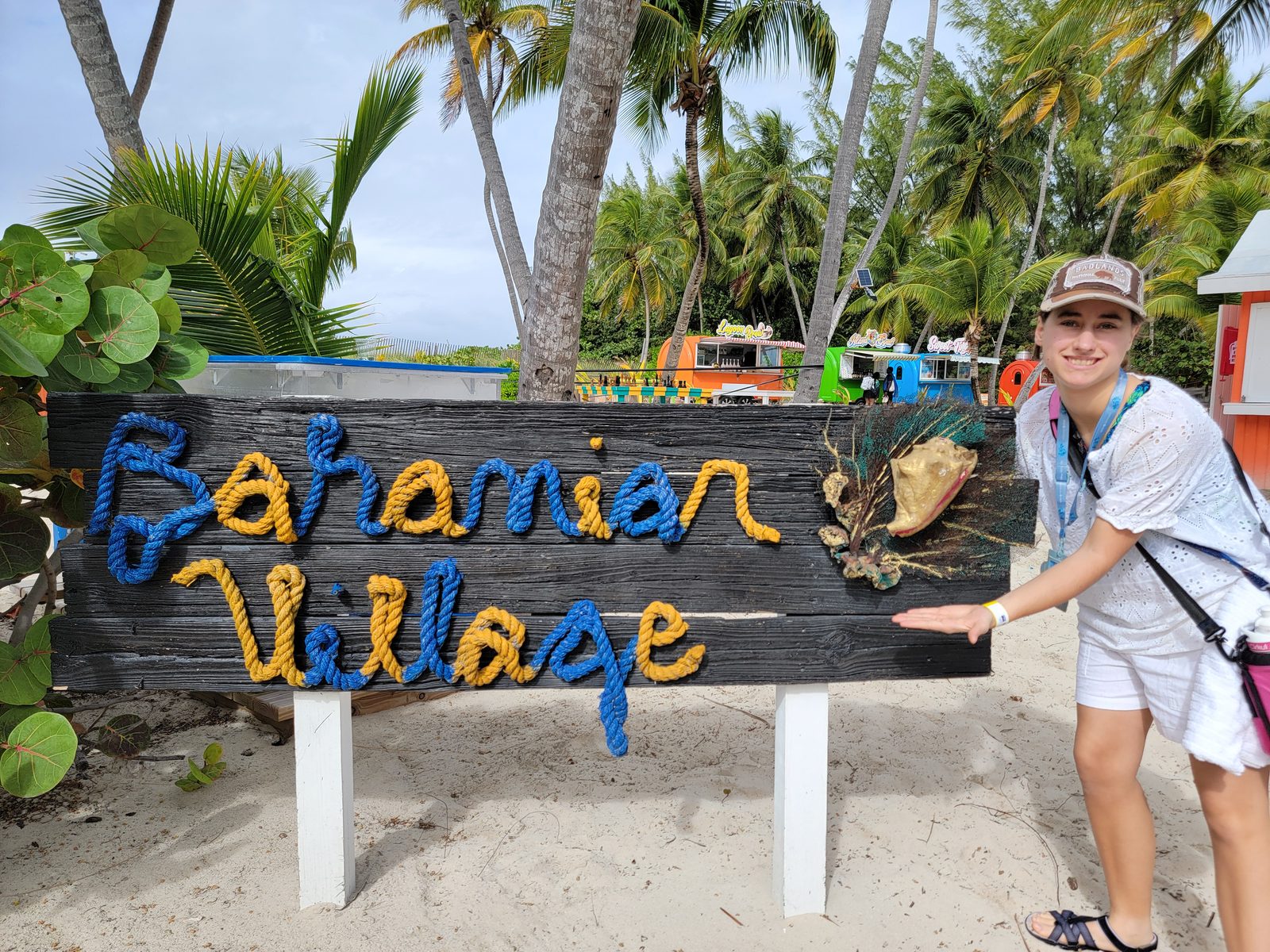 Lisa at the Bahamian Village sign on Blue Lagoon Island