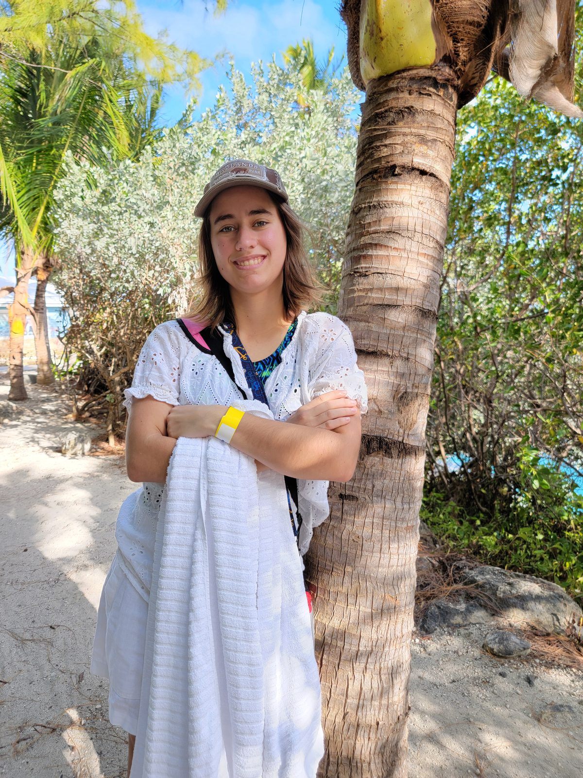 Lisa leaning against a palm tree on Blue Lagoon Island