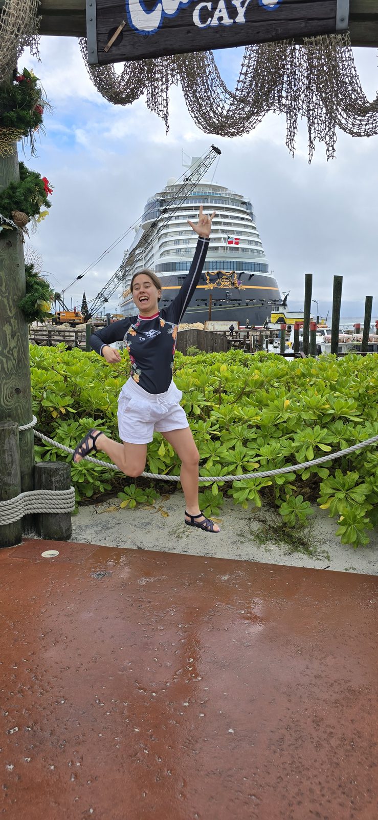 Lisa jumping for joy at the sign