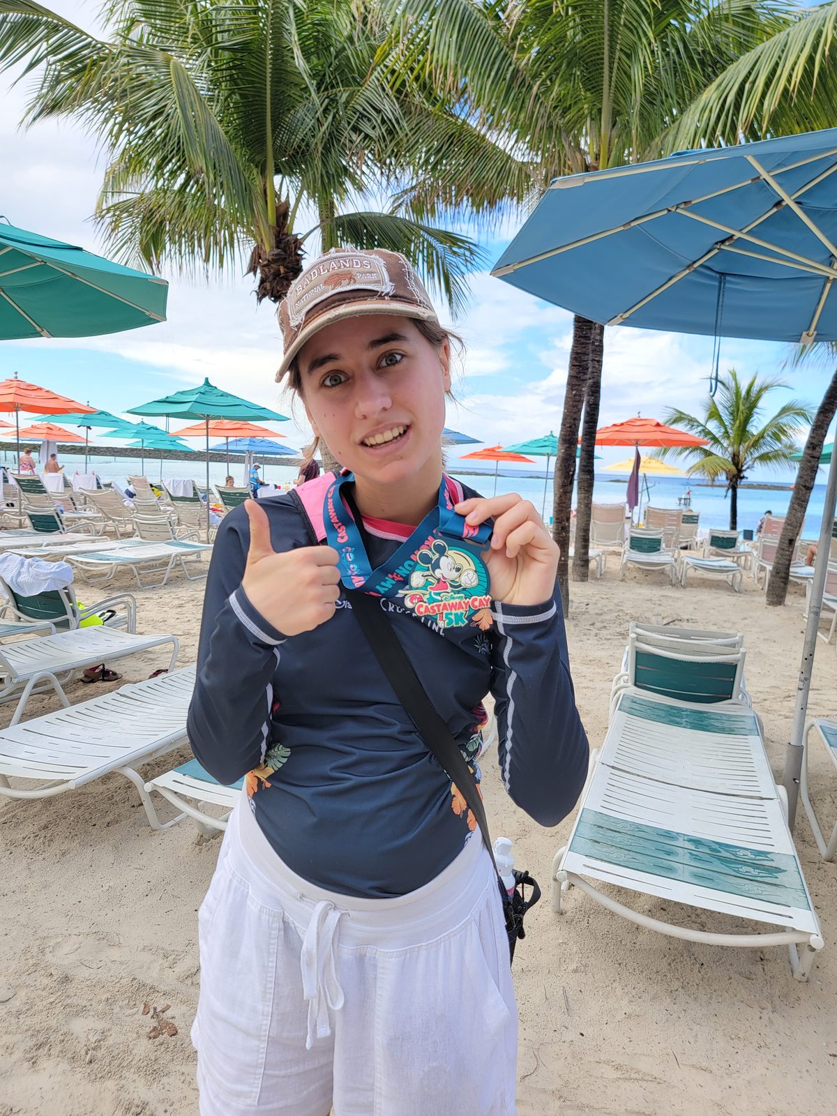 Lisa with her 5K medal at Castaway Cay