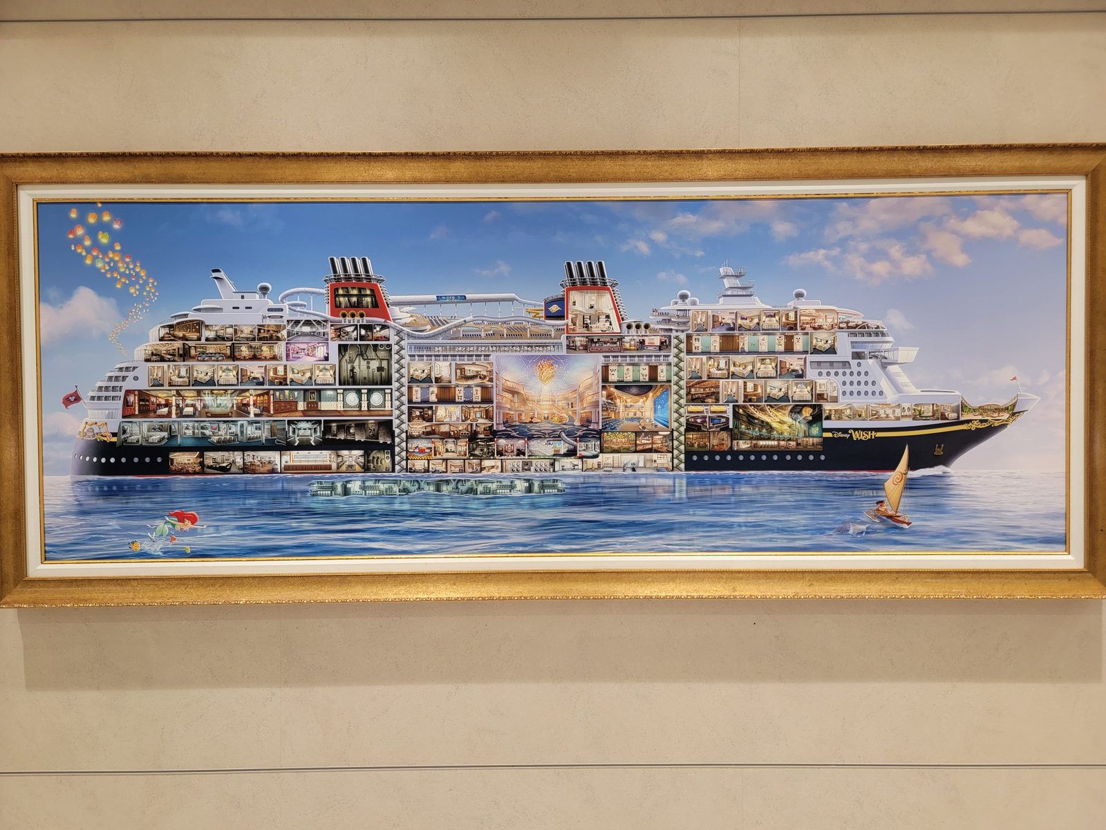 A framed painting of the ship, cut away to show its decks