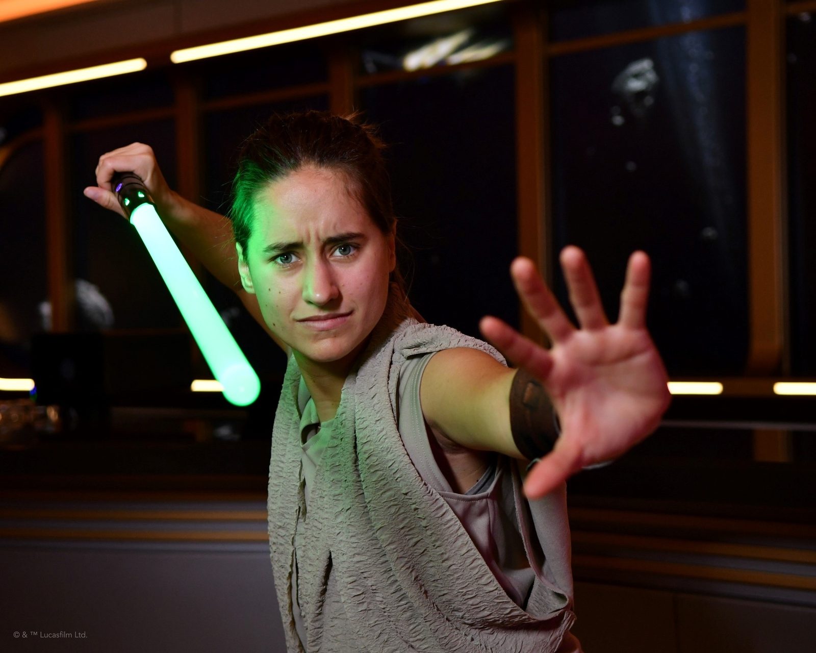 Lisa with a lightsaber in the Hyperspace Lounge