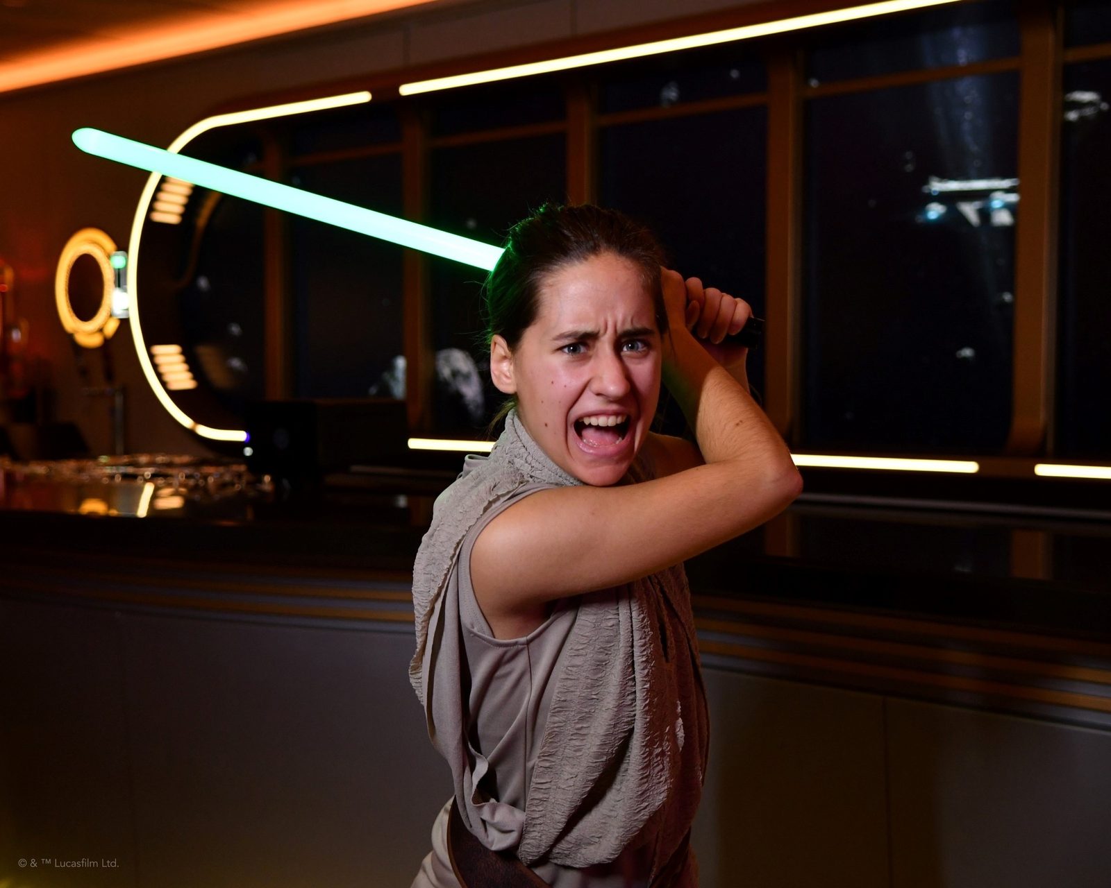 Lisa with a lightsaber in the Hyperspace Lounge