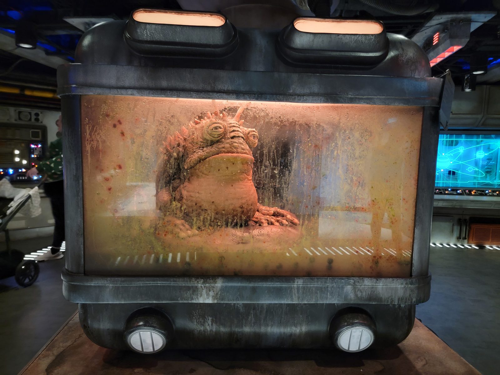 A creature in a tank in the Star Wars Cargo Bay