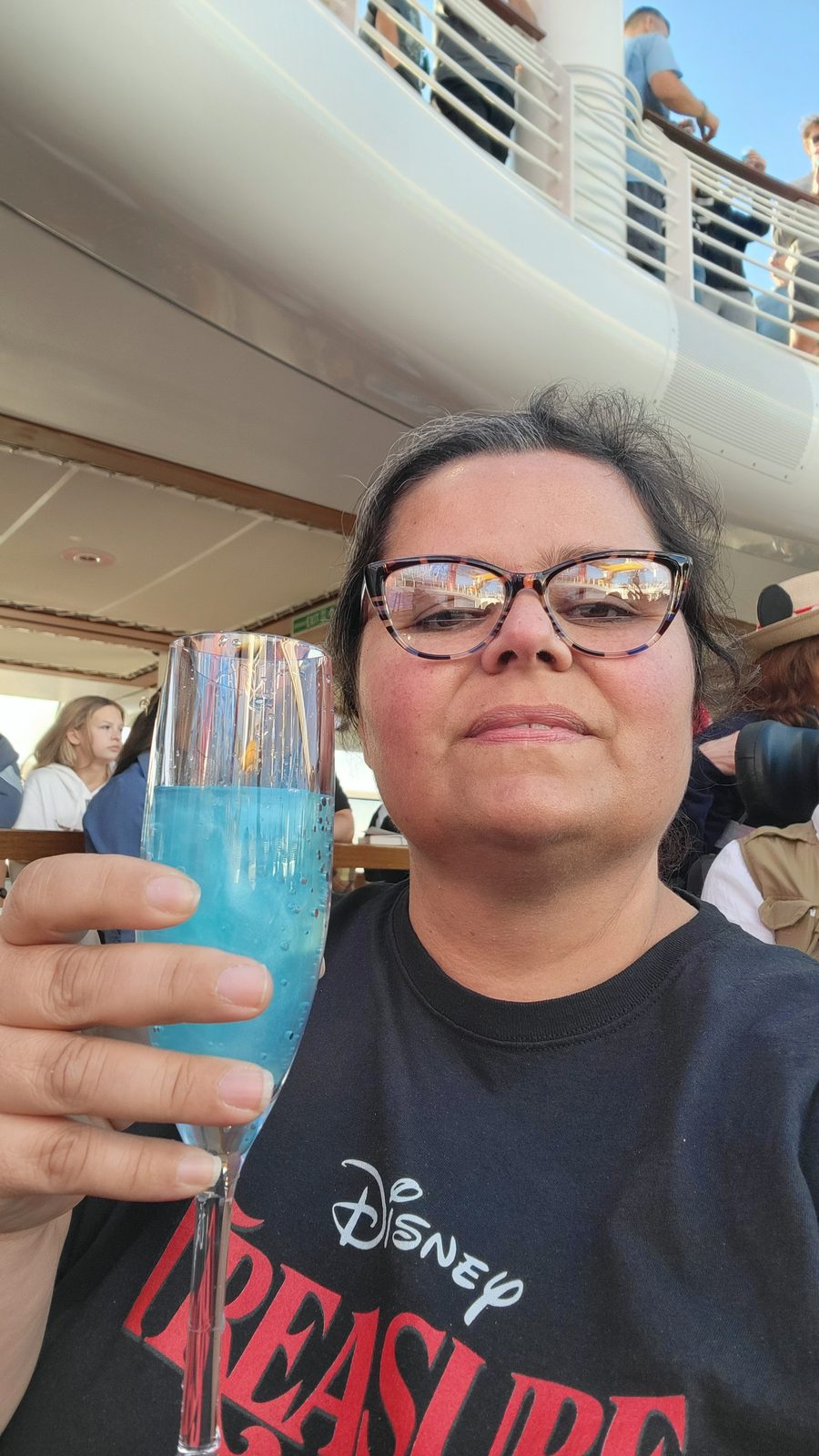 Kathy with her Cloudem Blue at sailaway on the Treasure