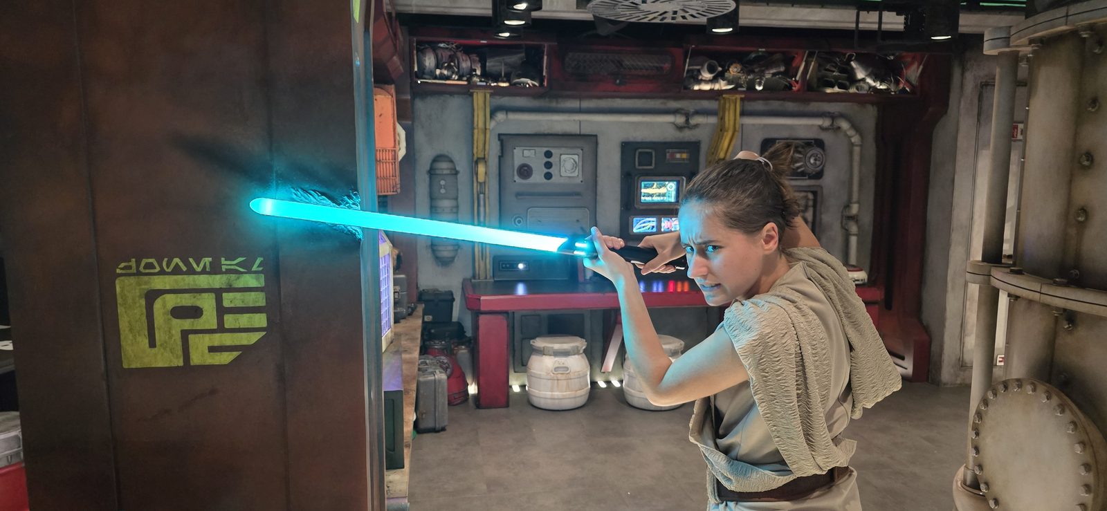 Lisa with a lightsaber on the Disney Treasure