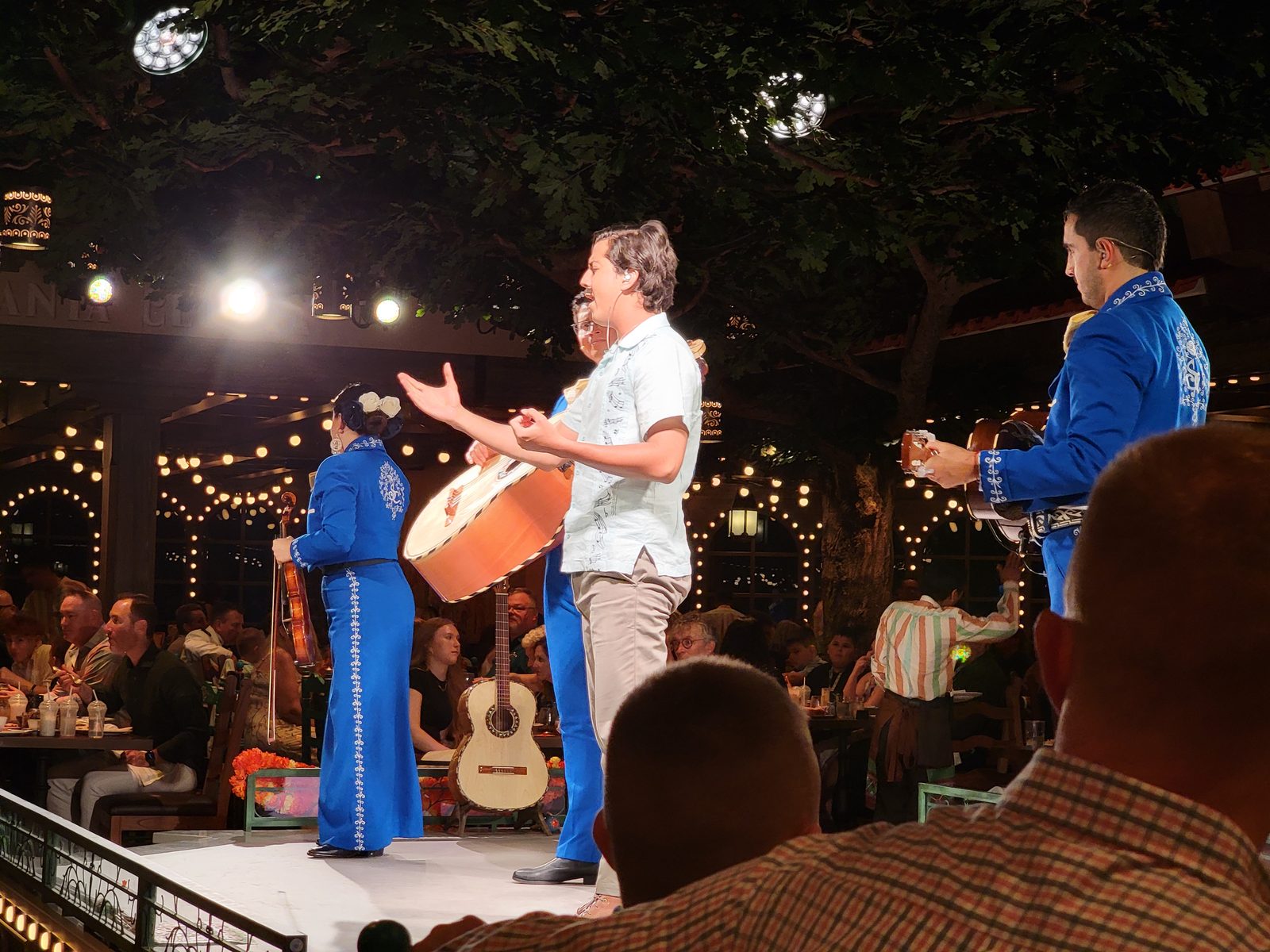 A mariachi trio plays at Plaza de Coco