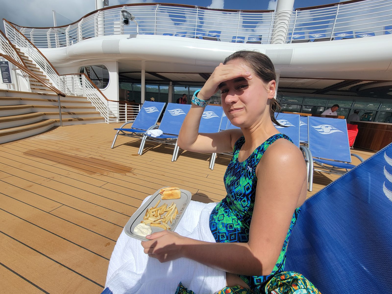 Lisa with her plate of fries on deck