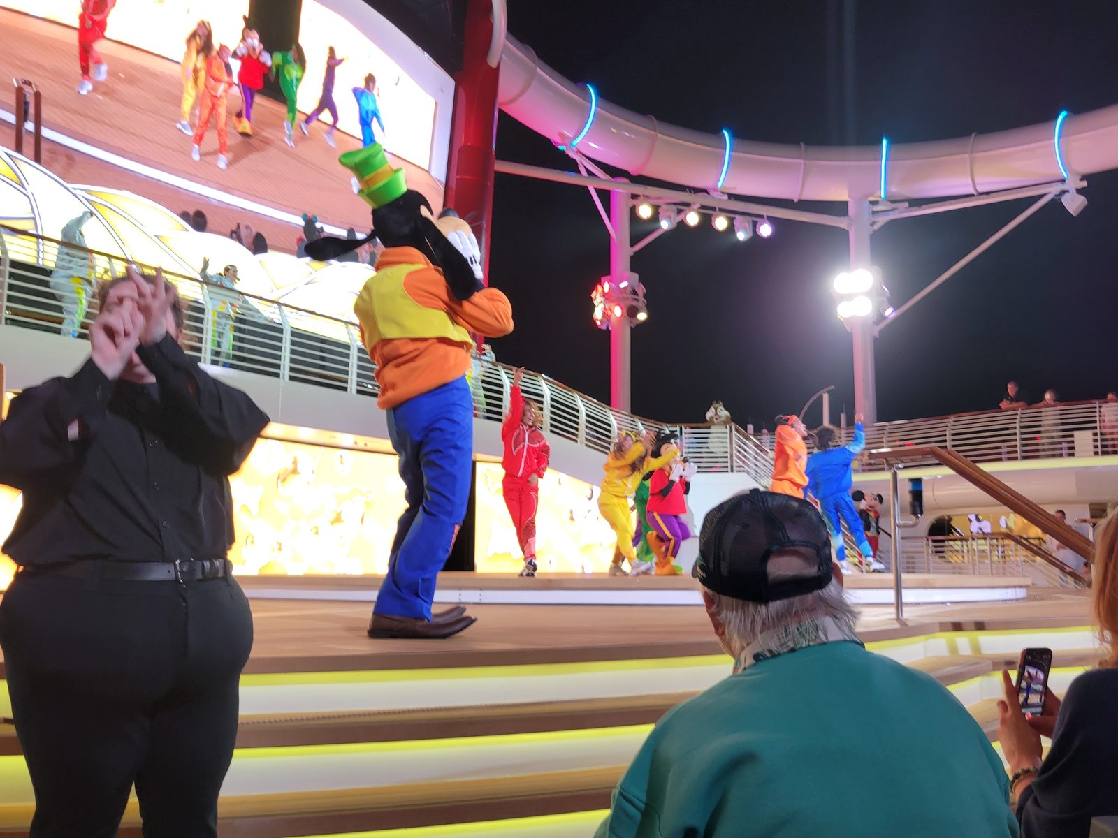 Kelly signing Mickey's Color Spin Dance Party with Goofy on stage