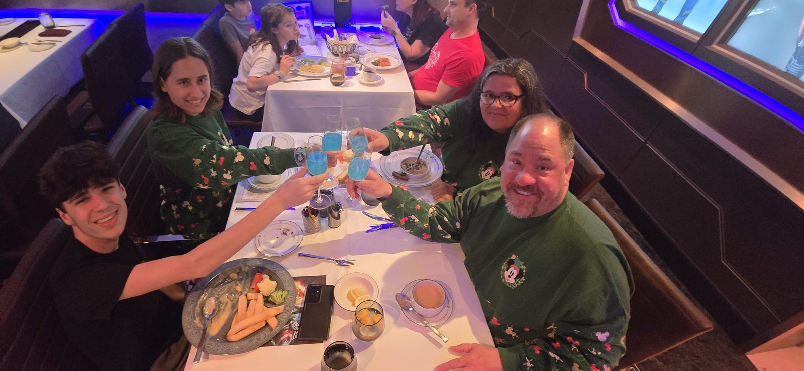 The four of us toasting with Cloudem Blue at Christmas dinner on the Treasure