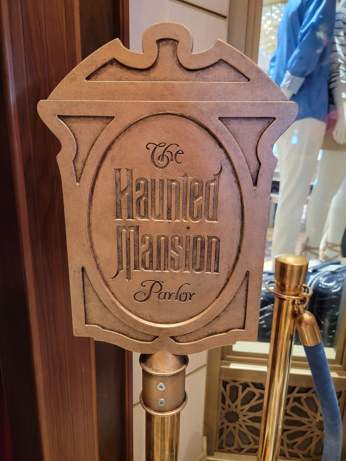 The Haunted Mansion Parlor sign on the Treasure