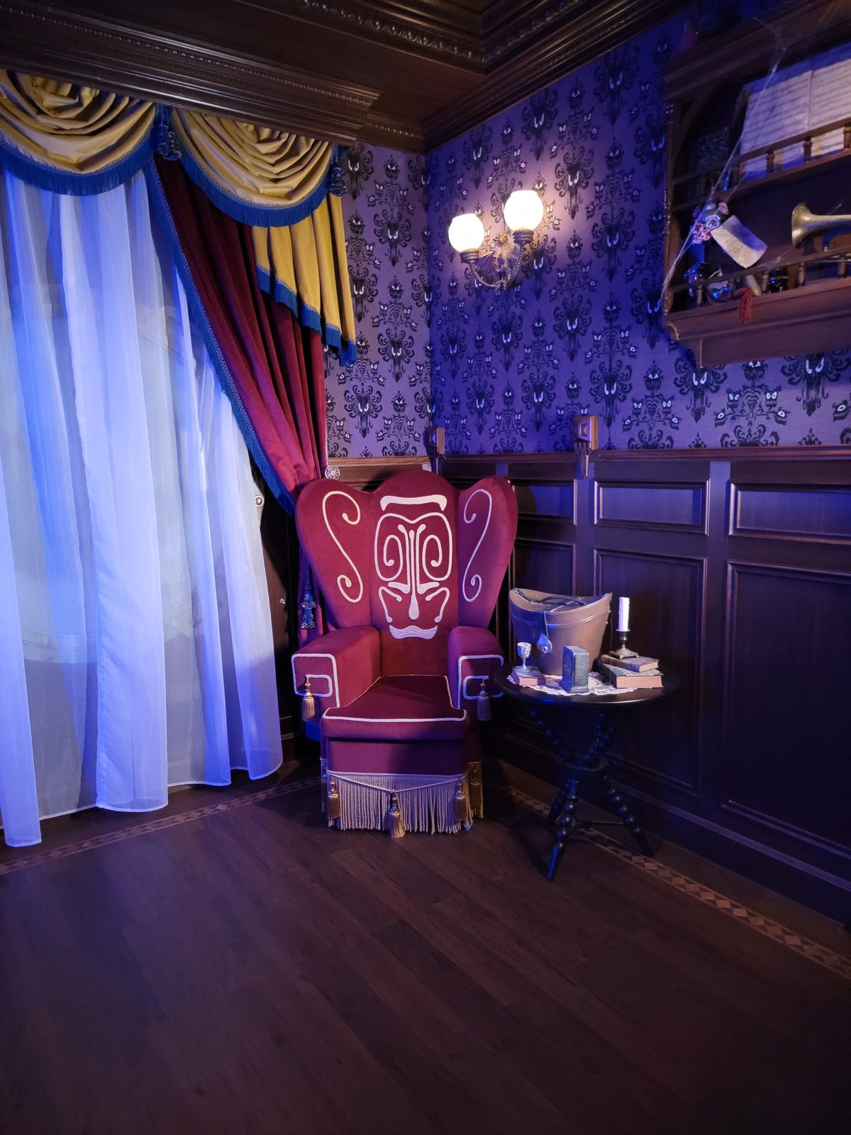 The red chair in the Haunted Mansion Parlor