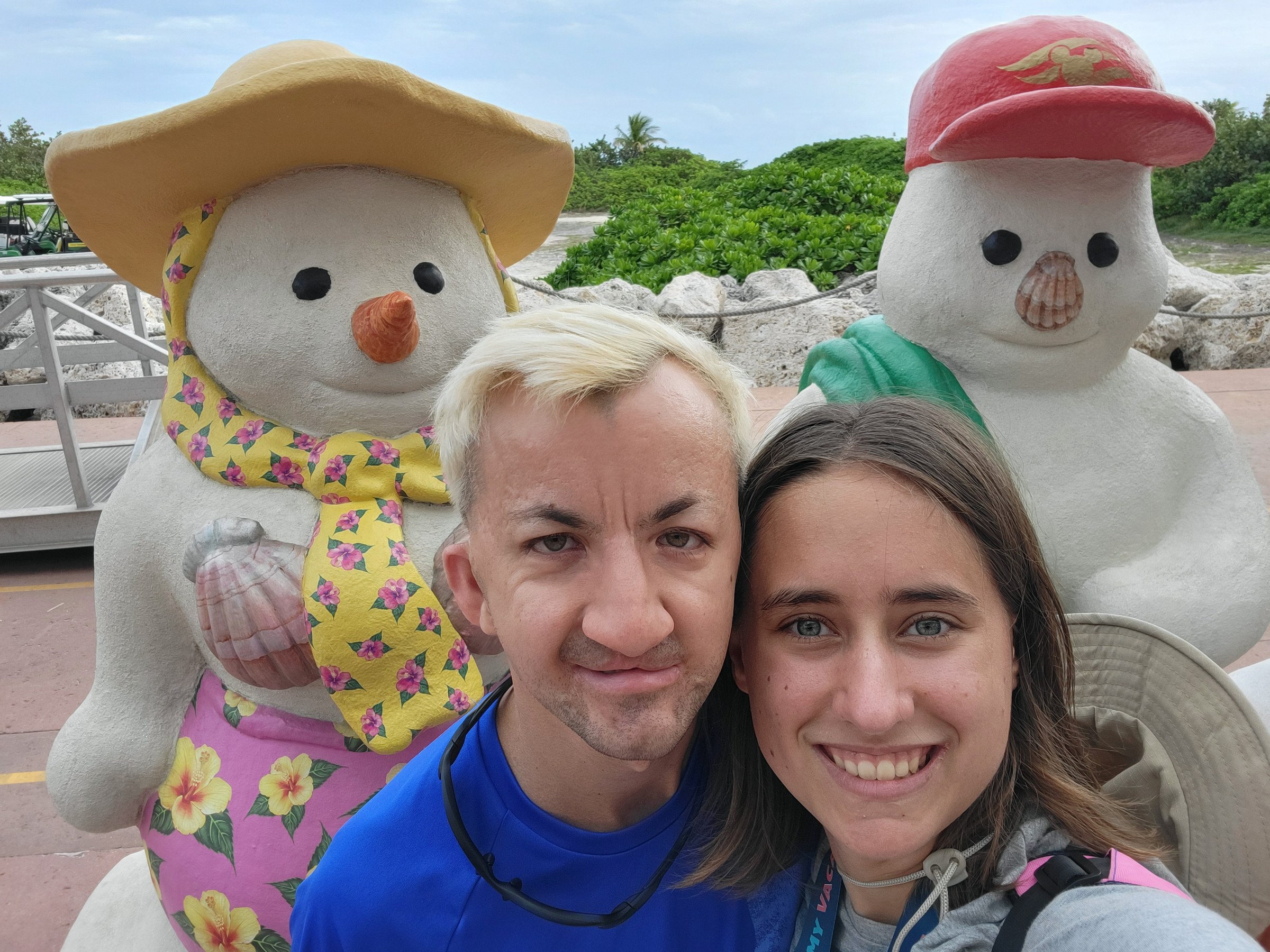 Marco and Lisa with the sand snowmen at Castaway Cay