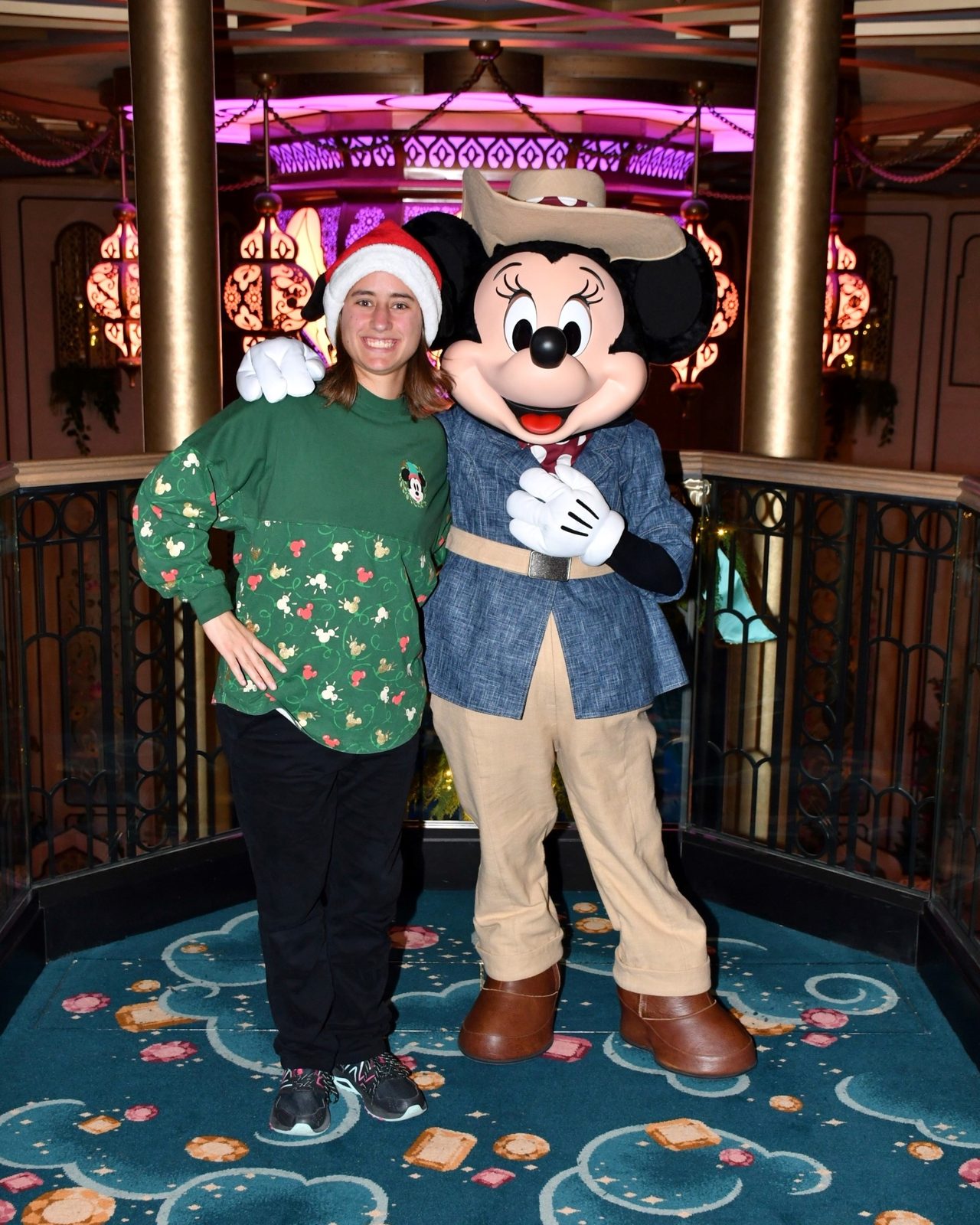 Lisa with Minnie Mouse in her Adventurer outfit in the Grand Hall