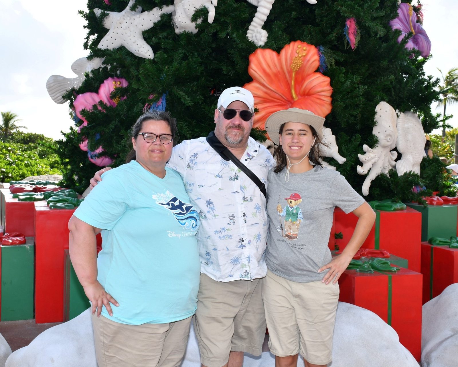 Kathy, Michael and Lisa by the Christmas tree at Castaway Cay