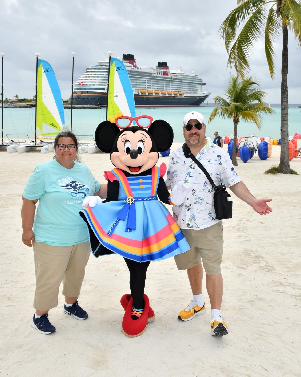 Kathy, Minnie Mouse in her Castaway Cay outfit & Michael at Castaway Cay