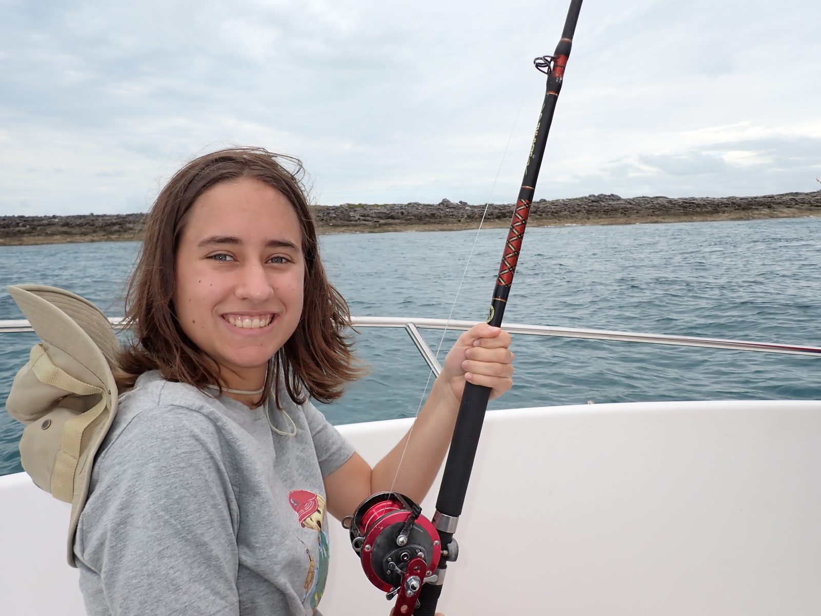 Lisa fishing from the charter boat
