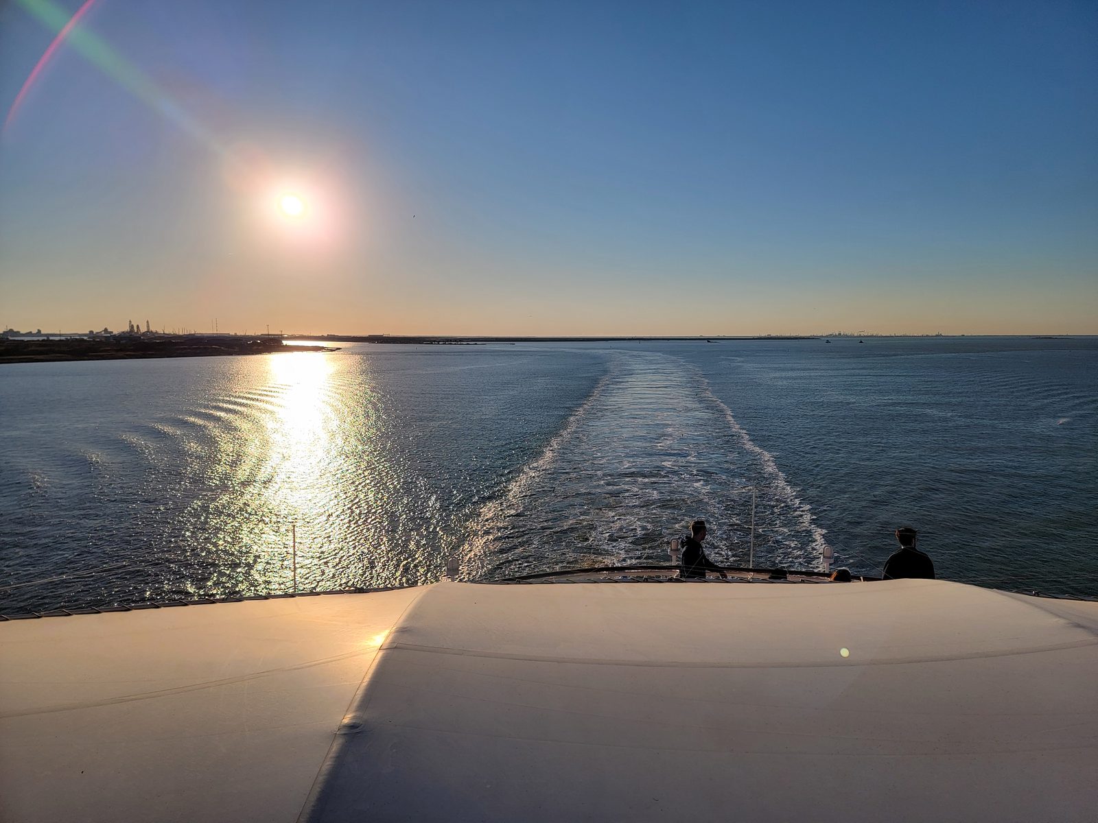 Watching the wake at sunset as Galveston fell behind