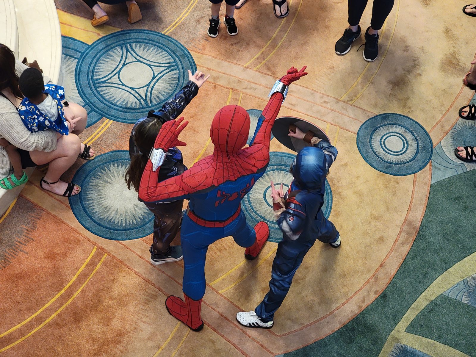 A Spider-Man character greets kids on deck