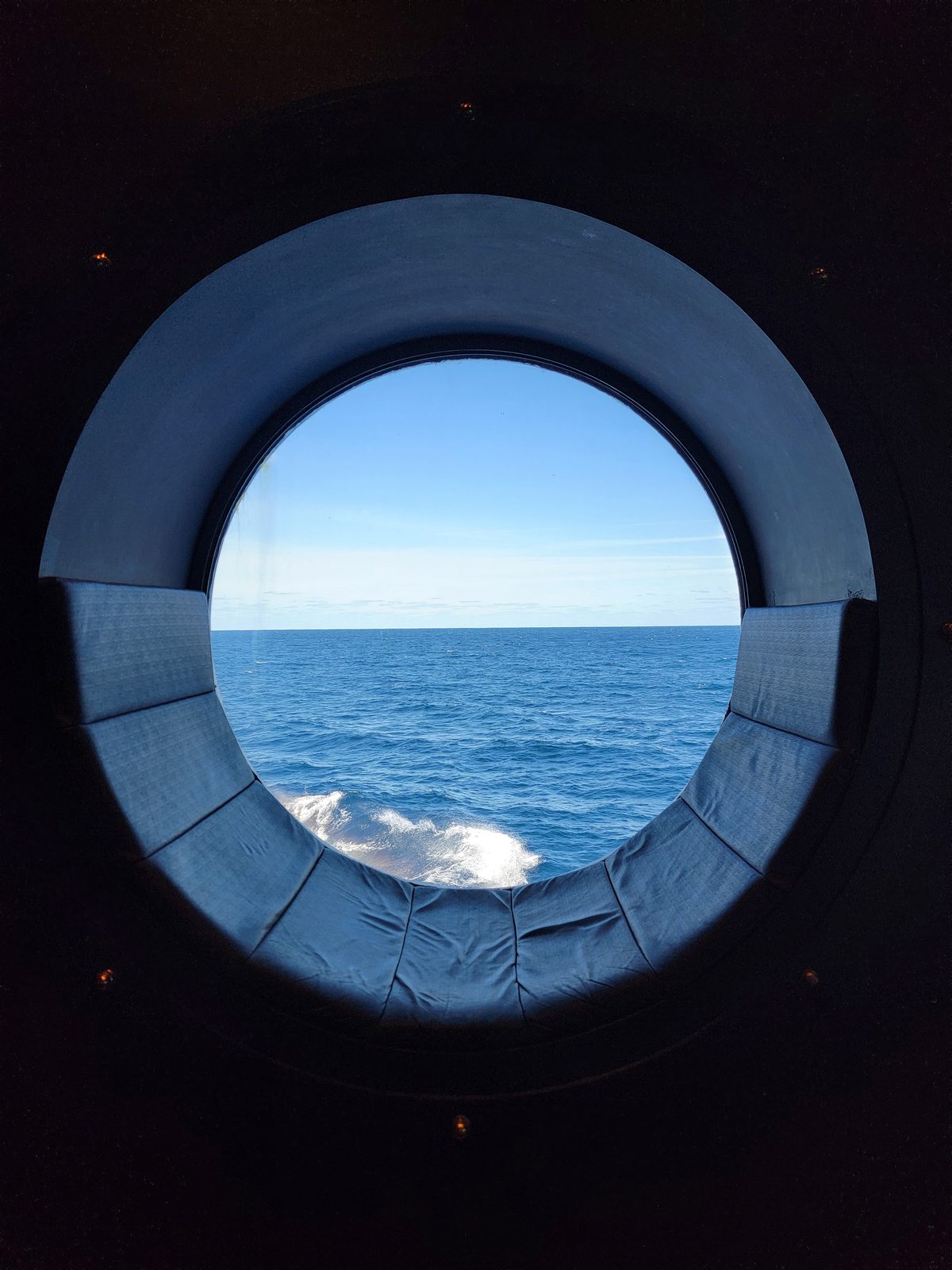 Blue water through the porthole