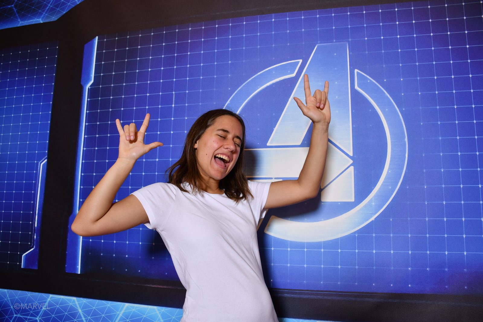 Lisa signing I love you at the Marvel wall