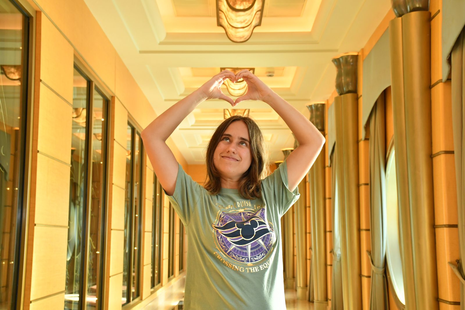 Lisa making a heart in the hallway on the Wonder