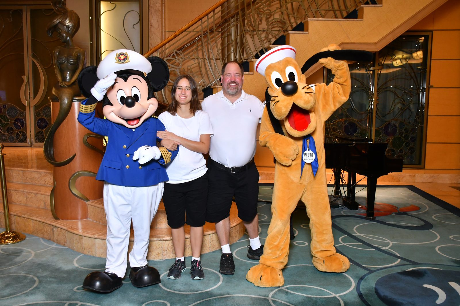 Captain Mickey, Lisa & Michael with Pluto in his sailor outfit in the Lobby Atrium