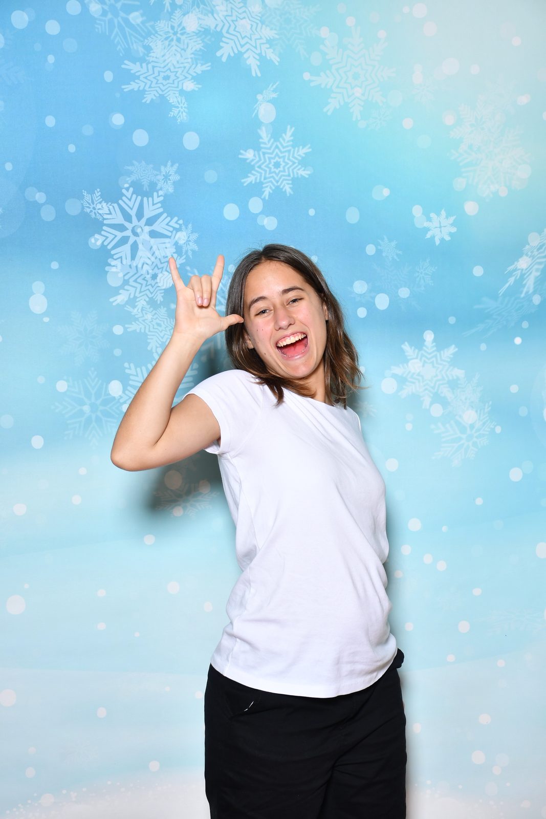 Lisa signing I love you in the snowflake portrait