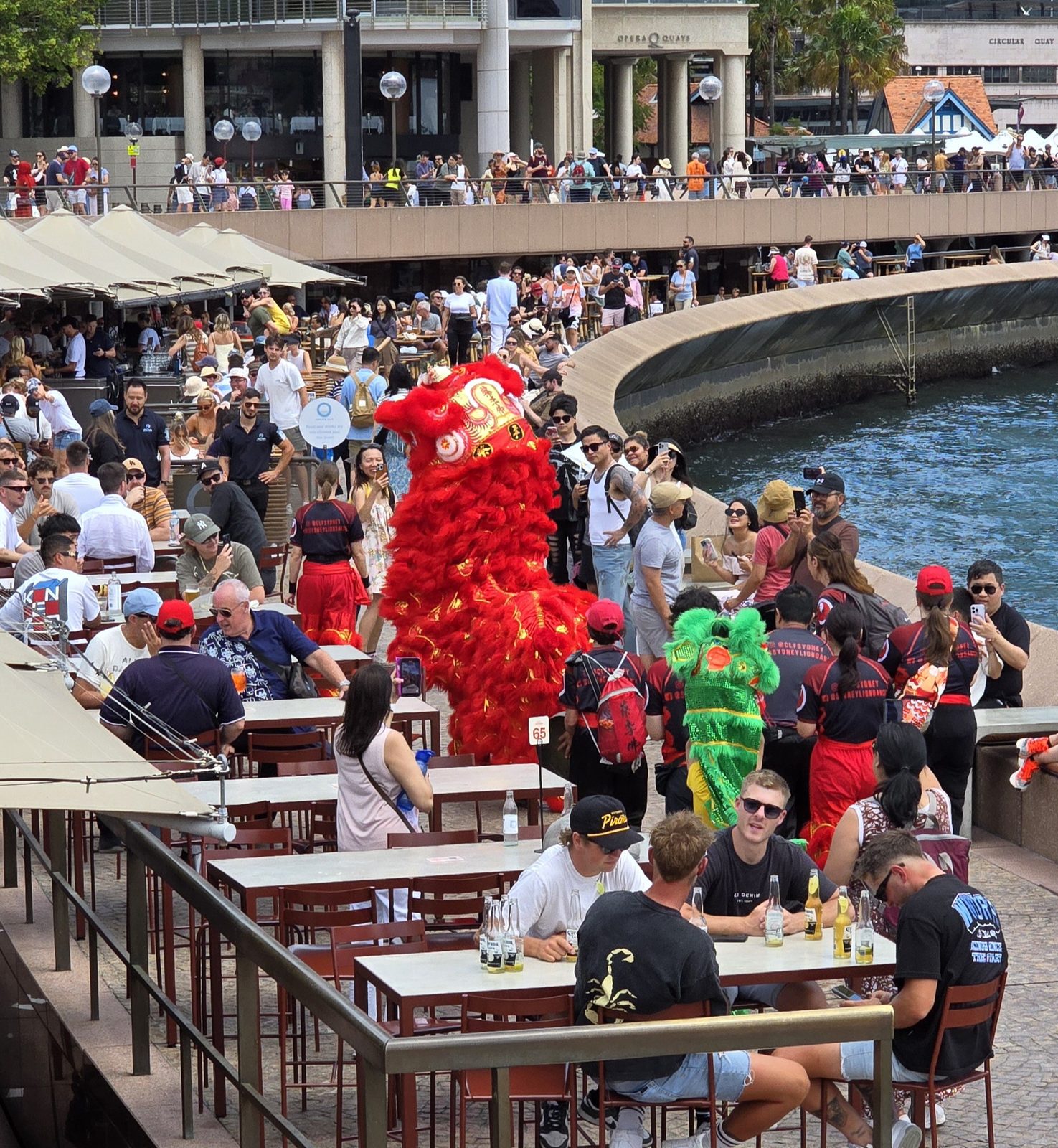 Lion dancers near the quay