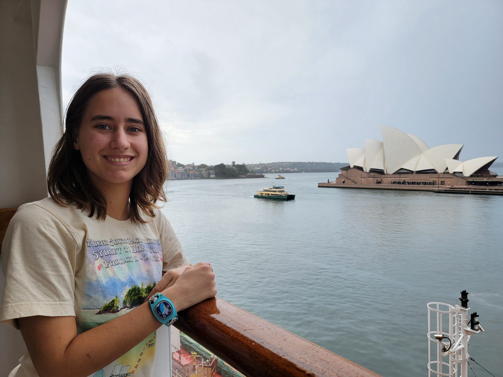 Lisa on our balcony with the Opera House behind