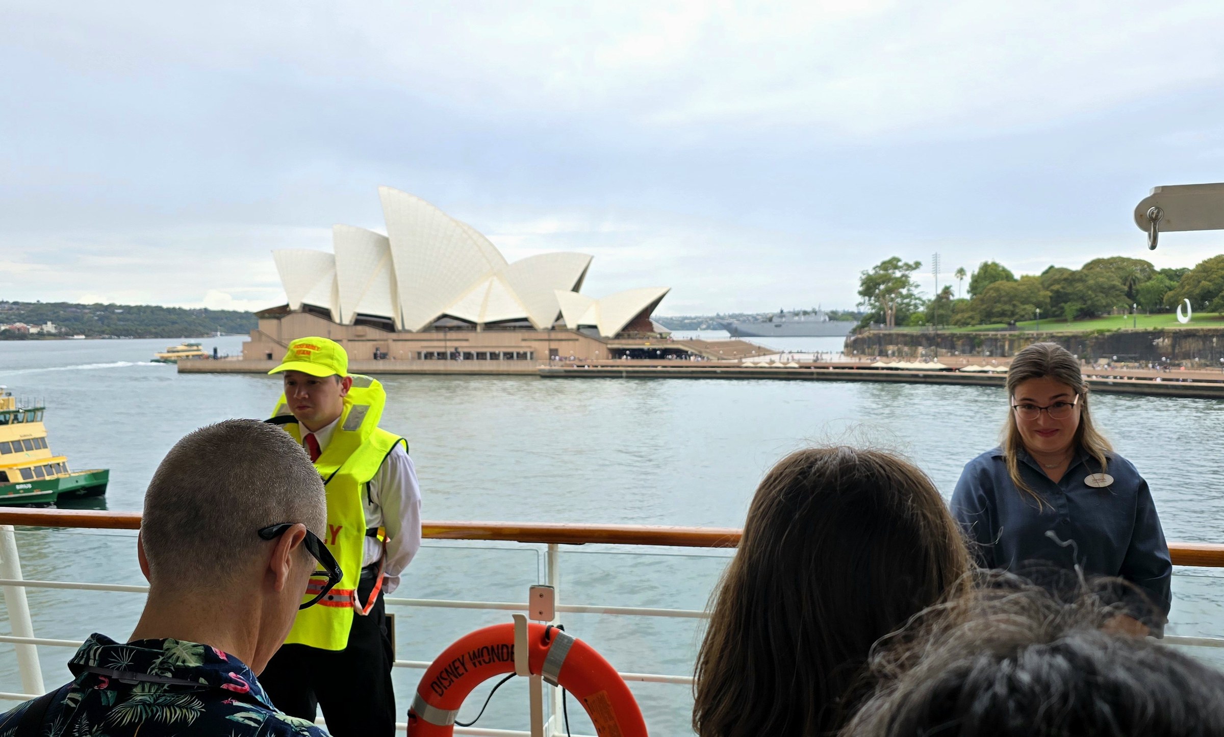 Jenna, one of our ASL interpreters, at the safety drill in Sydney, the Opera House behind her
