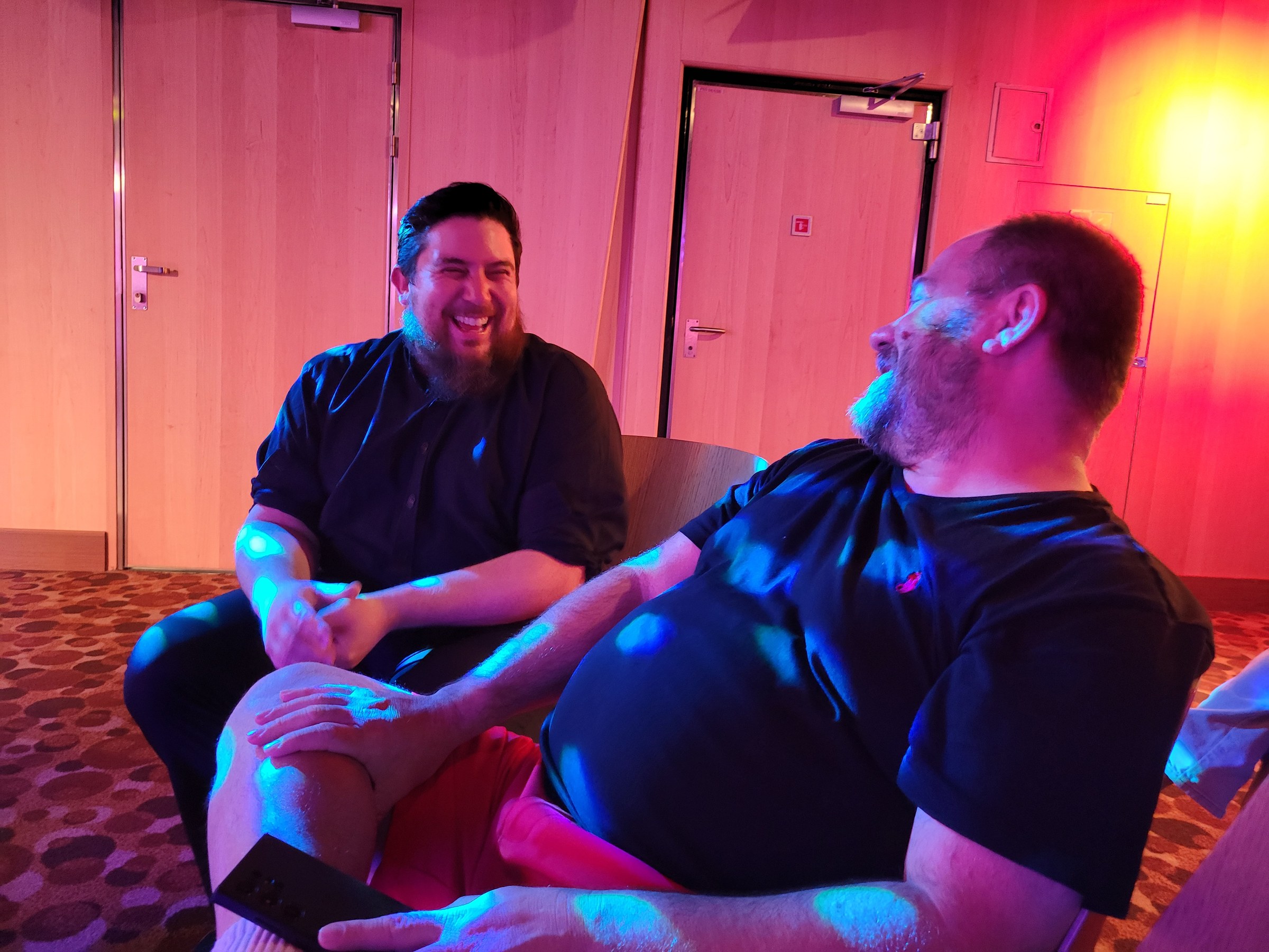 Alex, one of our ASL interpreters, sharing a laugh in the lounge