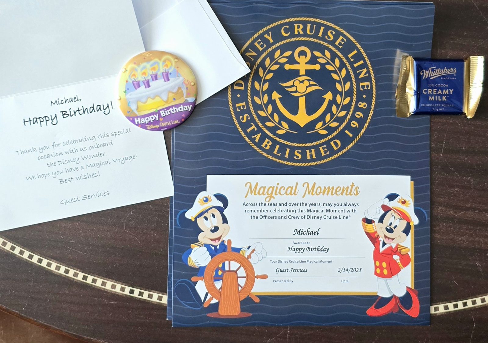 Birthday note, pin and certificate from Guest Services on the Wonder