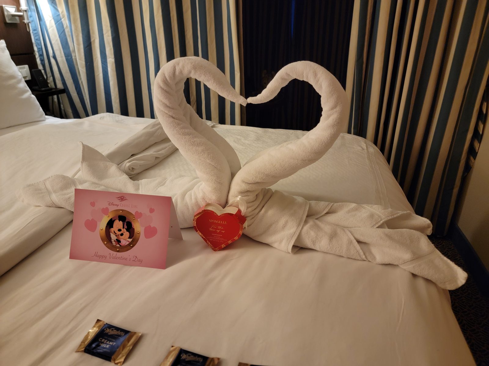 A swan heart towel animal and a Valentine's card