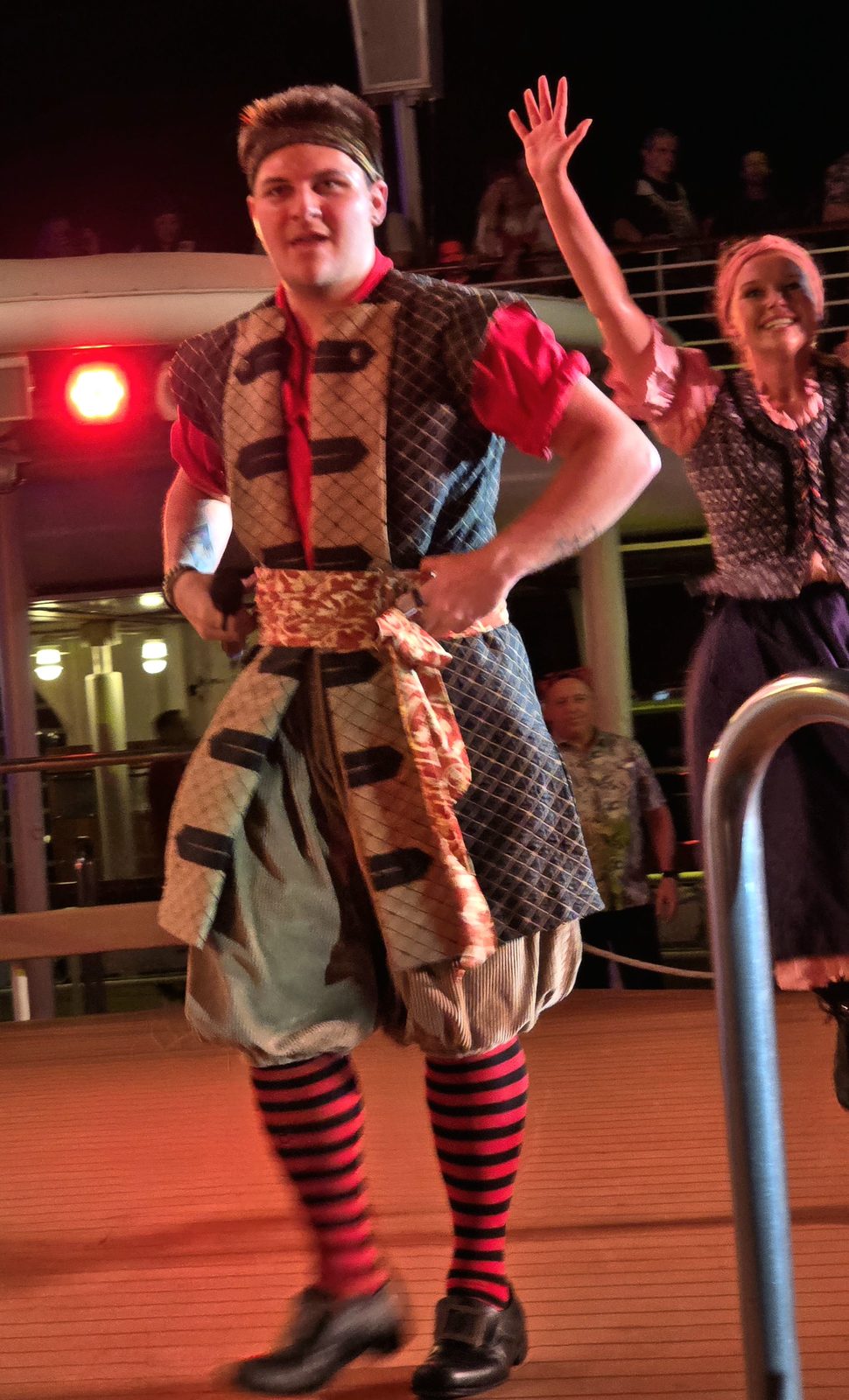 A pirate works the crowd on deck