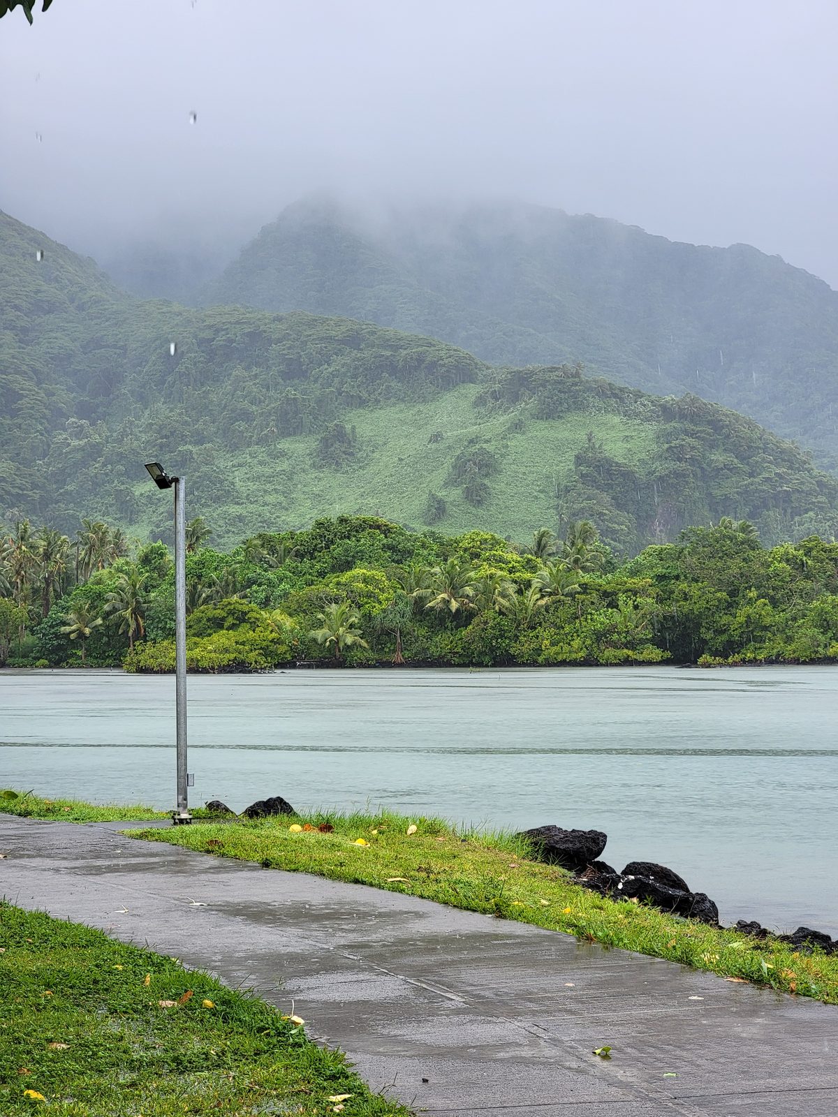 Rain over the shoreline on our Pago Pago day