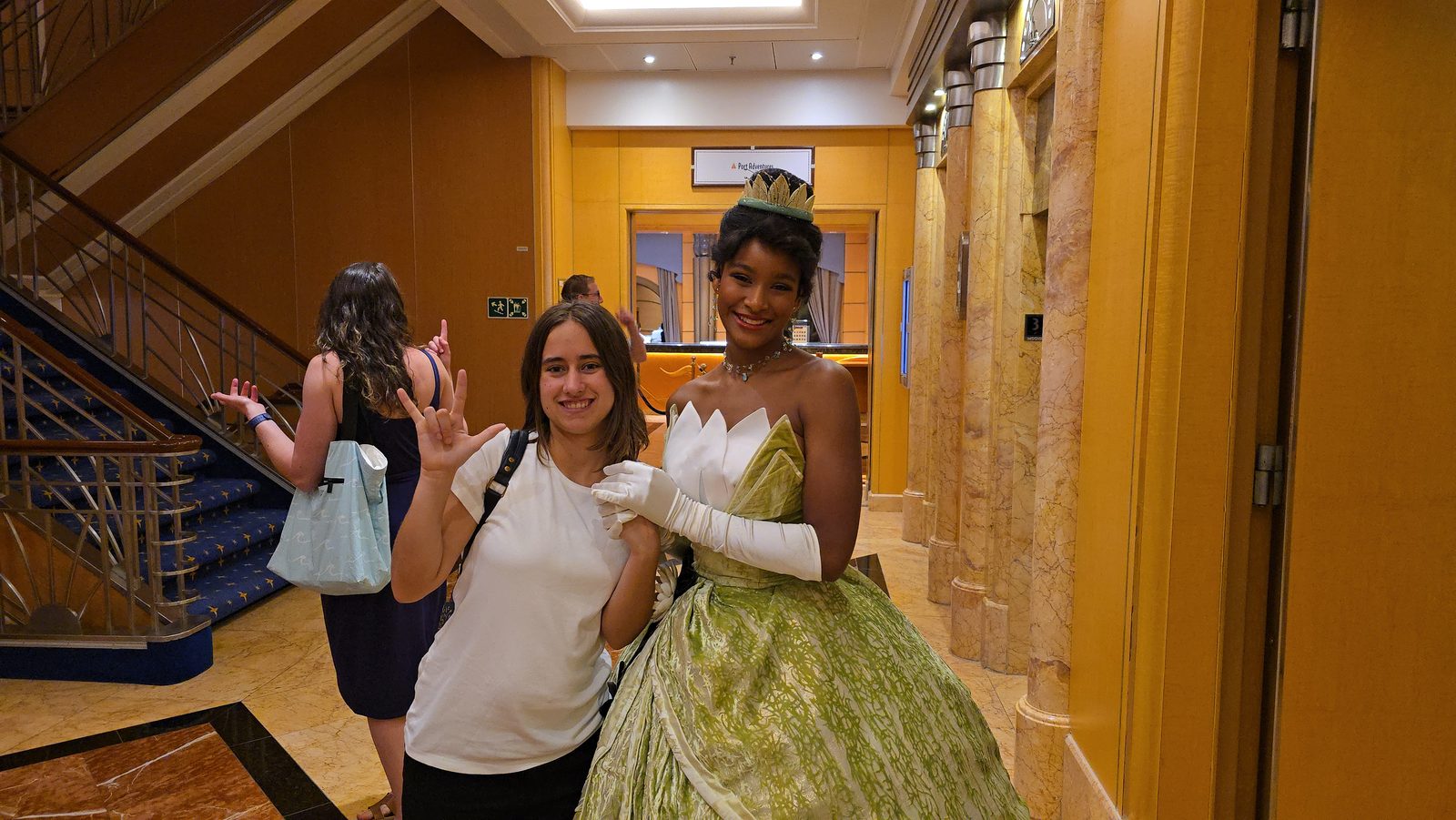 Lisa meeting Tiana in the atrium