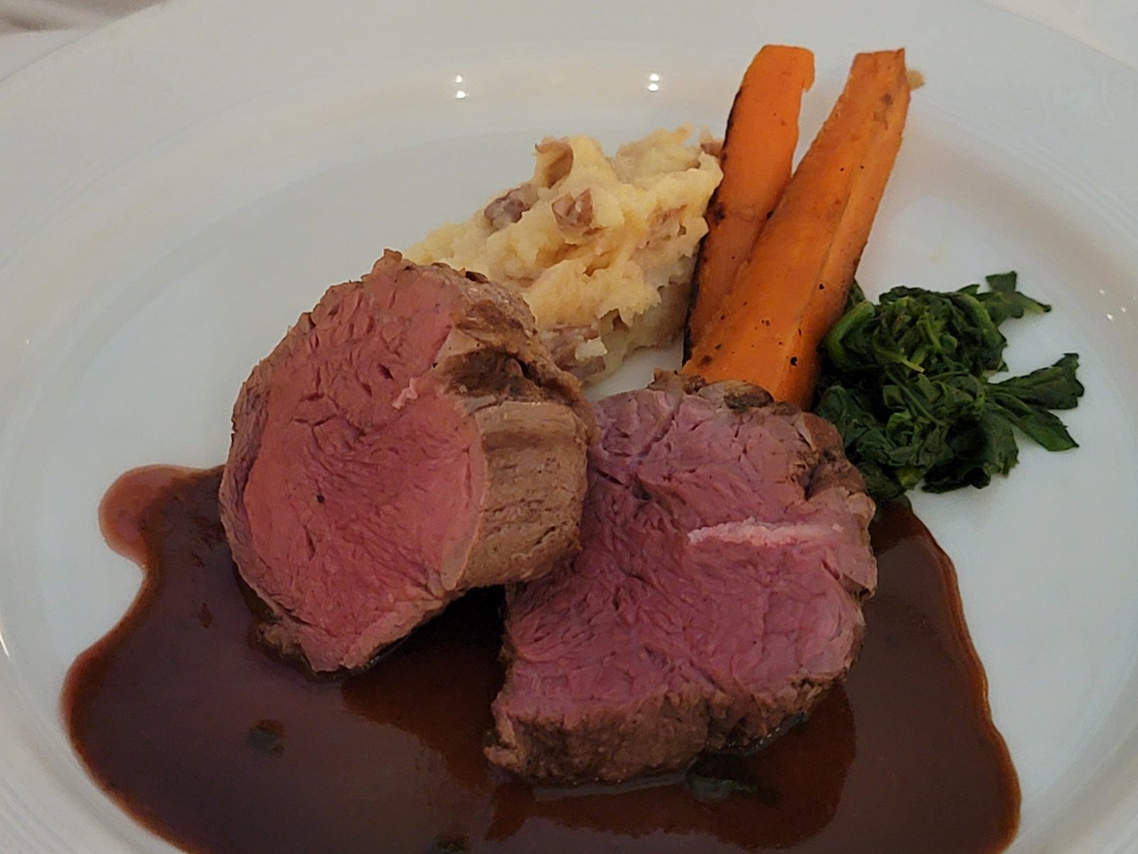 Beef tenderloin medallions at dinner